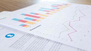 SEO reporting on paper with charts and graphs