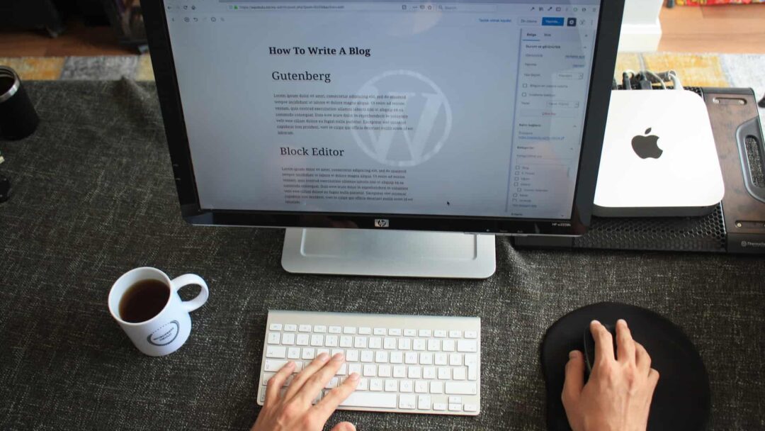 A person working on a computer with a WordPress page on the screen